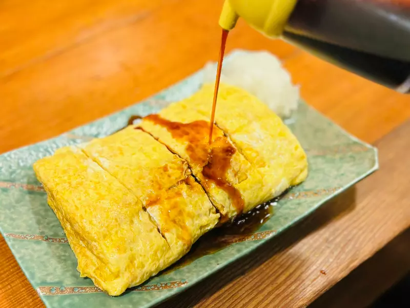 在日本京都吃玉子烧千万别蘸其他调料！食客只因多加一勺酱油，竟被本地人骂上热搜！